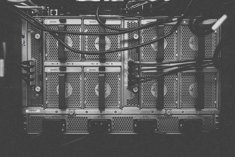 Close-up of server hardware and cabling in a rack.
